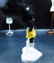 small black hp doll yellow a